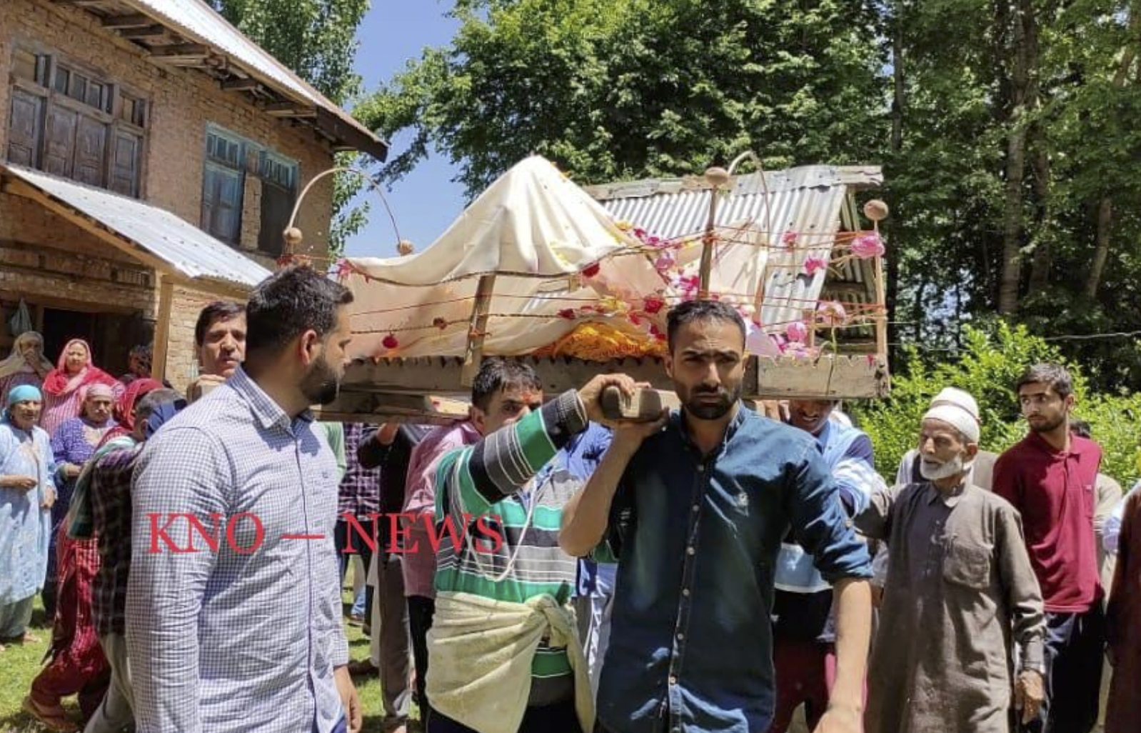The Latest: Muslim neighbors perform last rites of Kashmiri Pandit woman in south Kashmir